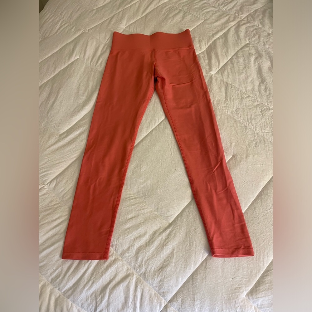Carbon 38 shiny corral colored leggings